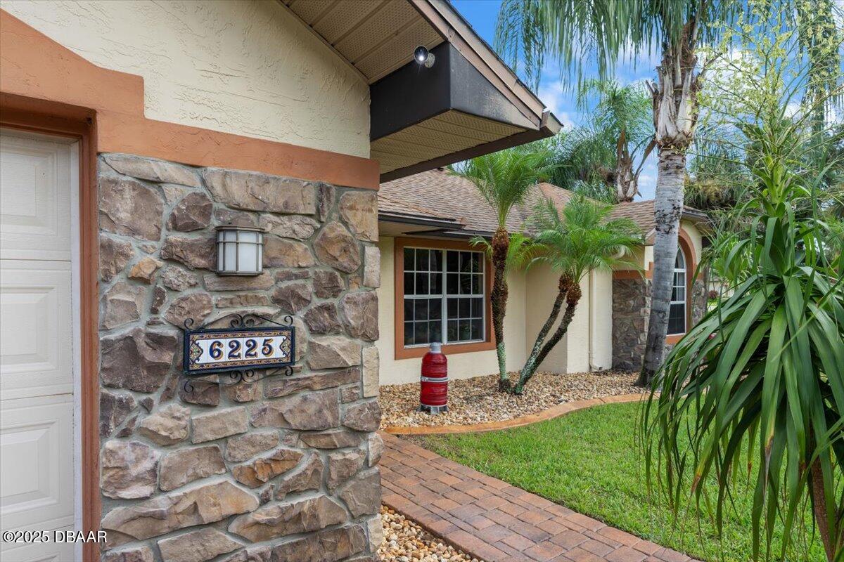 6225 Ranier Circle Port Orange, FL 32127 - Photo 2 of 50 a front view of a house with a yard
