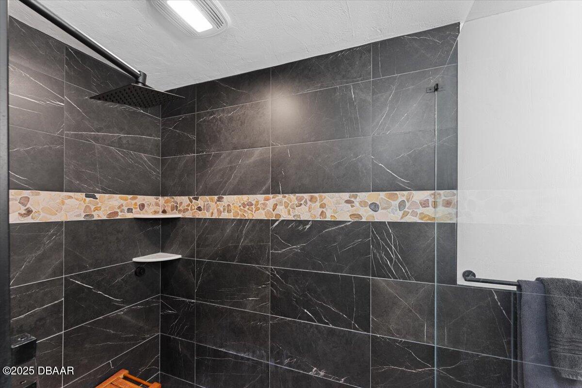 6225 Ranier Circle Port Orange, FL 32127 - Photo 23 of 50 a bathroom with a shower and a sink
