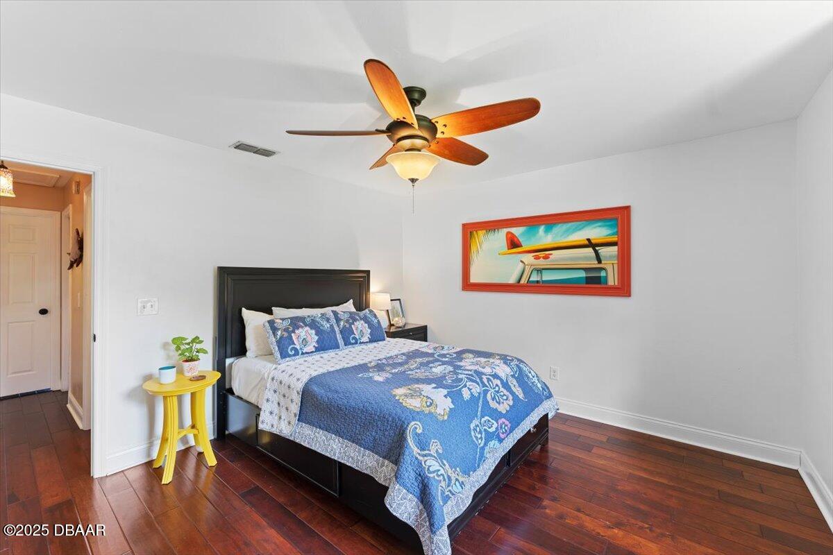 6225 Ranier Circle Port Orange, FL 32127 - Photo 26 of 50 a bedroom with a bed and wooden floor