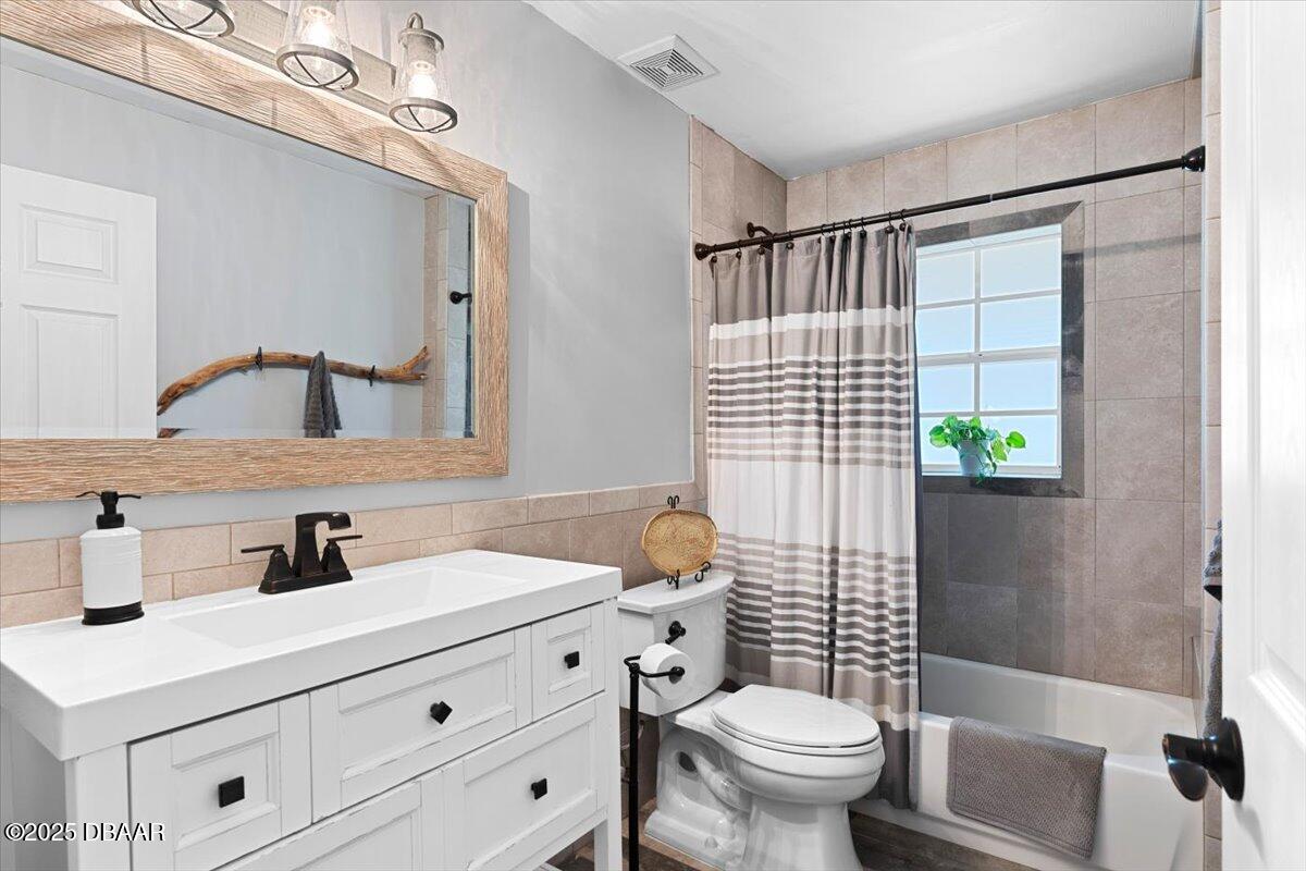 6225 Ranier Circle Port Orange, FL 32127 - Photo 27 of 50 a bathroom with a sink toilet and shower