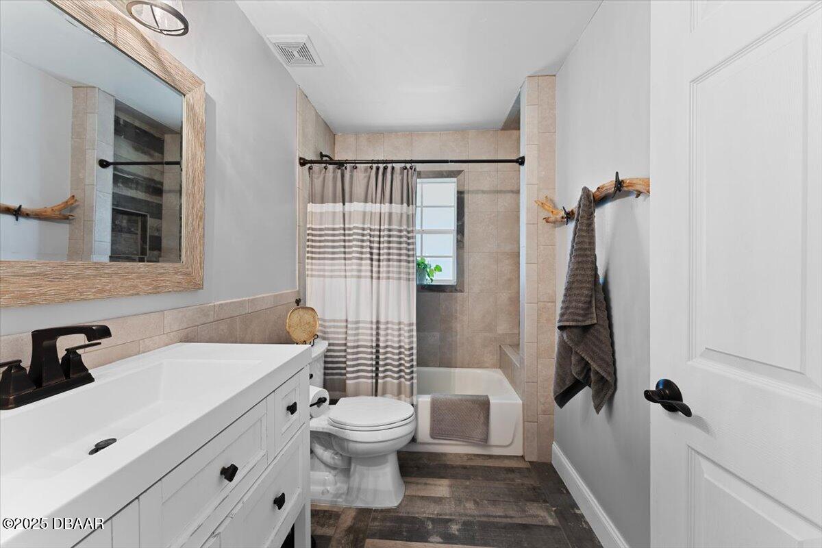 6225 Ranier Circle Port Orange, FL 32127 - Photo 28 of 50 a bathroom with a sink toilet and shower