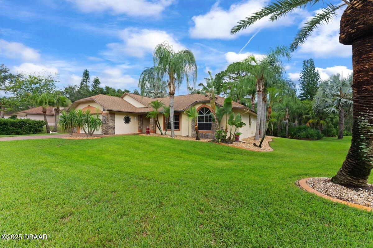 6225 Ranier Circle Port Orange, FL 32127 - Photo 34 of 50 a view of a house with a yard