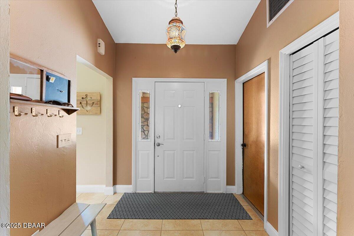6225 Ranier Circle Port Orange, FL 32127 - Photo 4 of 50 a view of a bedroom with wooden floor and a ceiling fan