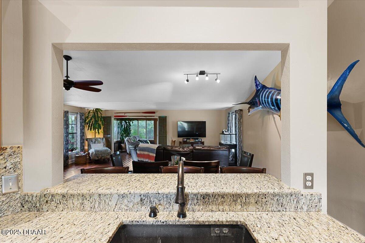 6225 Ranier Circle Port Orange, FL 32127 - Photo 7 of 50 a living room with furniture and a flat screen tv