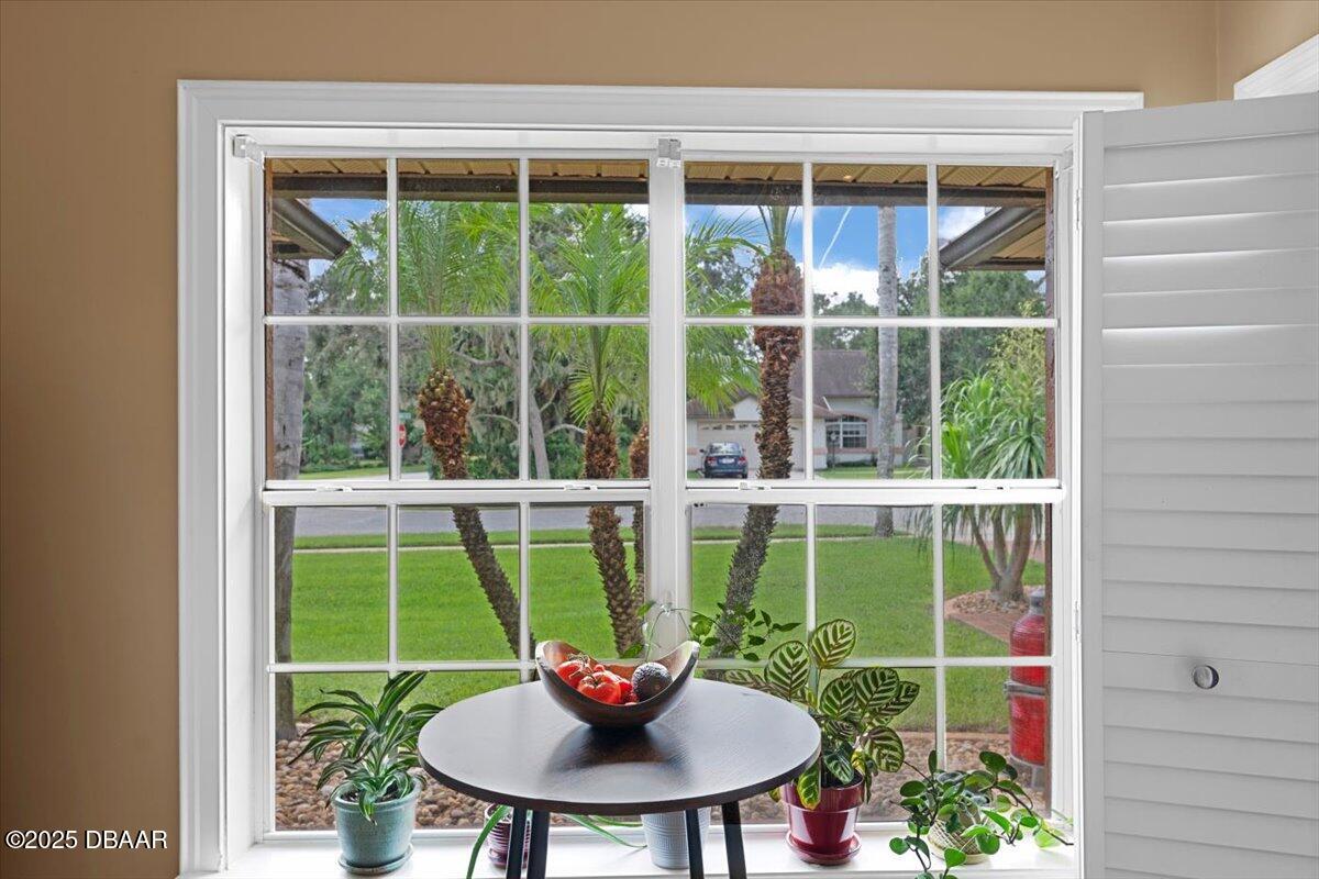 6225 Ranier Circle Port Orange, FL 32127 - Photo 10 of 50 a view of a deck with table and chairs and potted plants