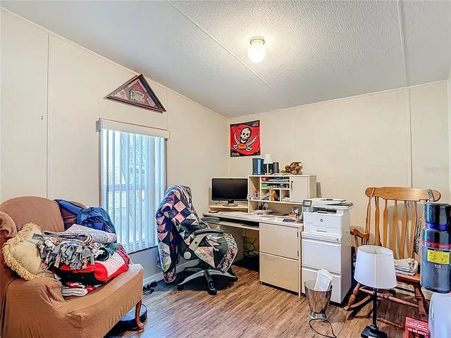 a bedroom with furniture and a window