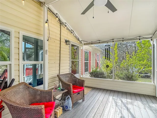 a house view with a sitting space and glass windows