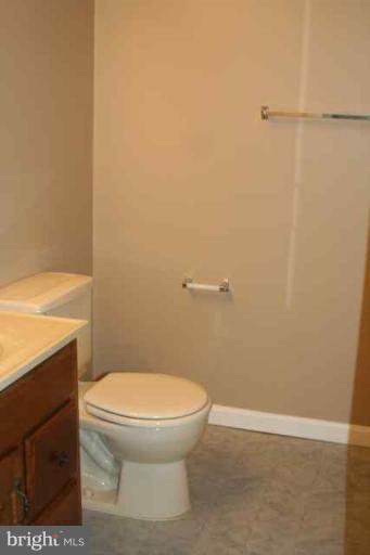 6 Hobb Court Perry Hall, MD 21128 - Photo 13 of 20 a white toilet sitting next to a shower