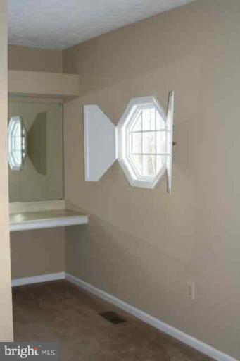 6 Hobb Court Perry Hall, MD 21128 - Photo 4 of 20 an empty room with wooden floor and windows