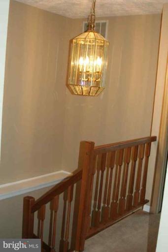 6 Hobb Court Perry Hall, MD 21128 - Photo 8 of 20 a view of staircase with railing and chandelier