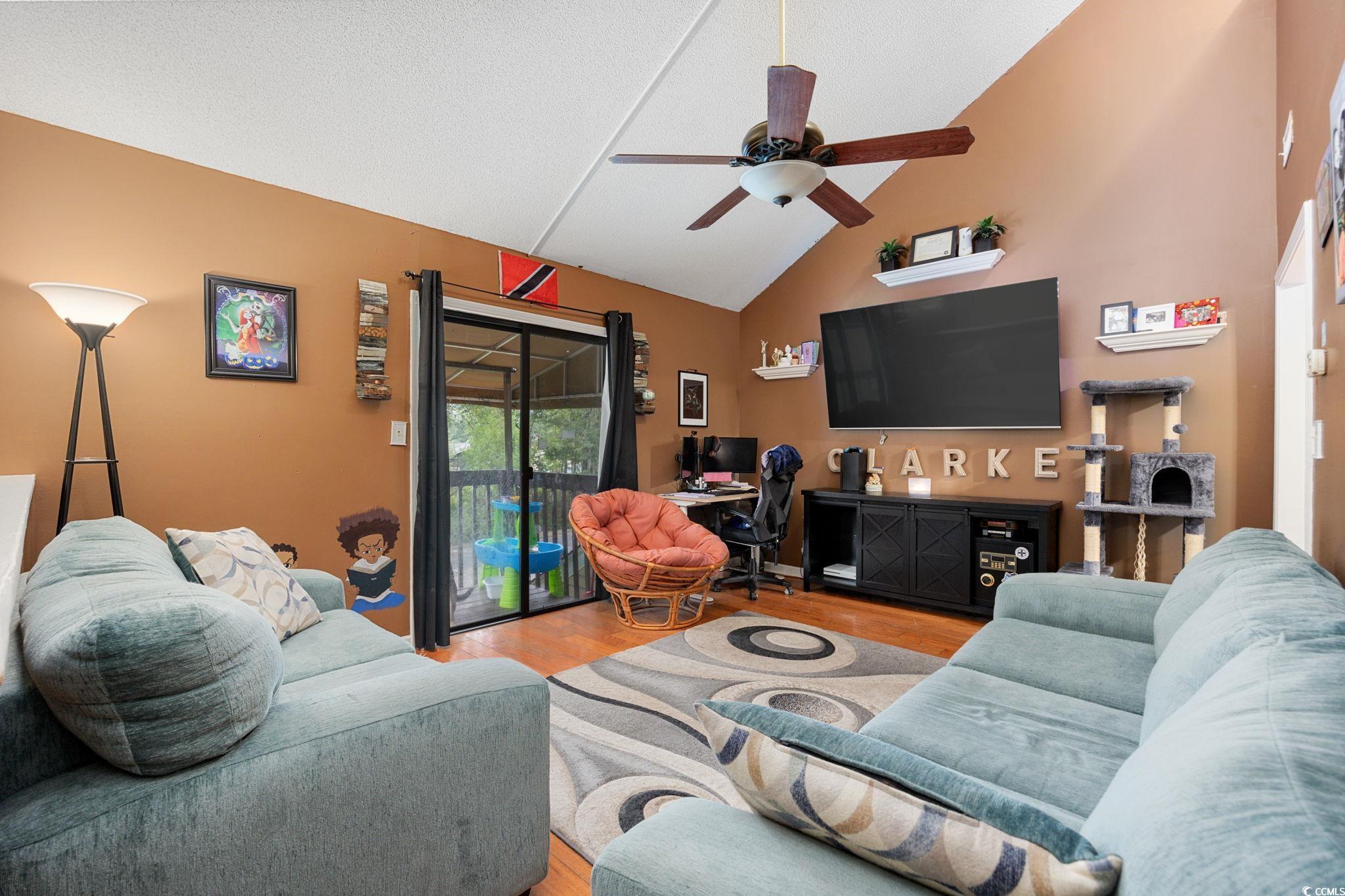 755 Burcale Road, Unit F4 Myrtle Beach, SC 29579 - Photo 16 of 30 Living area featuring light wood finished floors, ceiling fan, high vaulted ceiling, and an office area