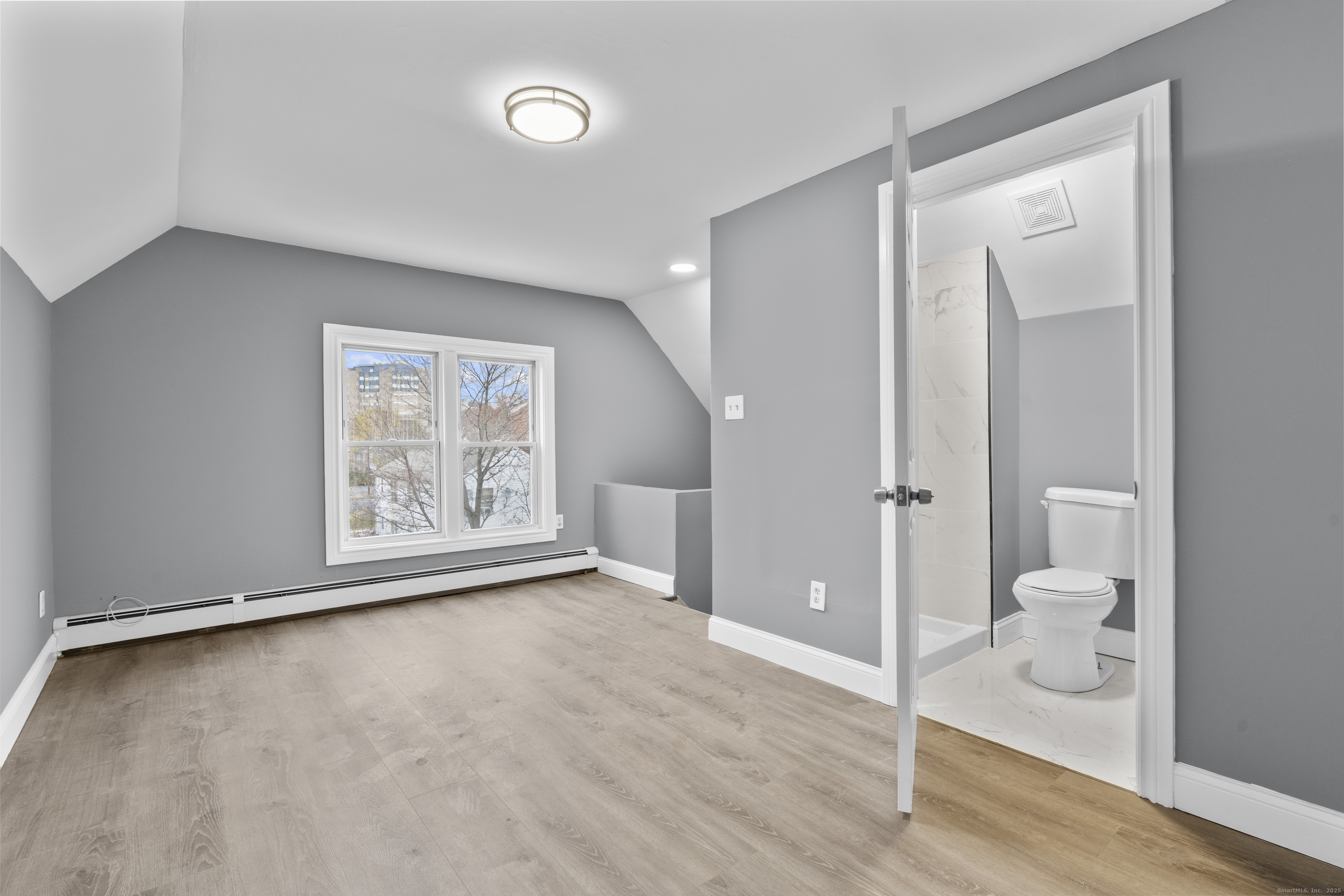 55 Elliott Street, Unit 3 New Haven, CT 06519 - Photo 12 of 18 a view of an empty room and room with wooden floor