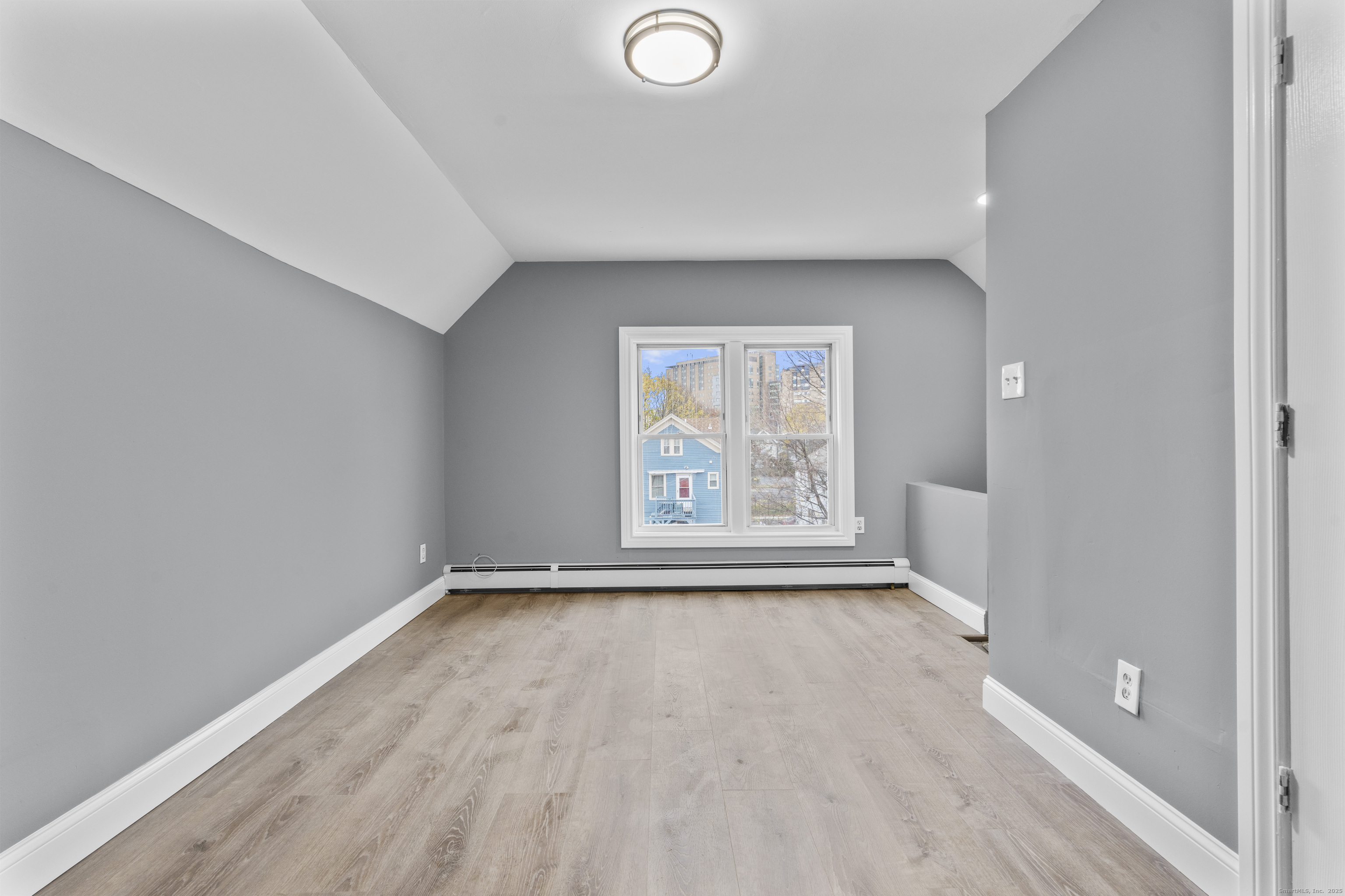 55 Elliott Street, Unit 3 New Haven, CT 06519 - Photo 13 of 18 wooden floor in an empty room with a window