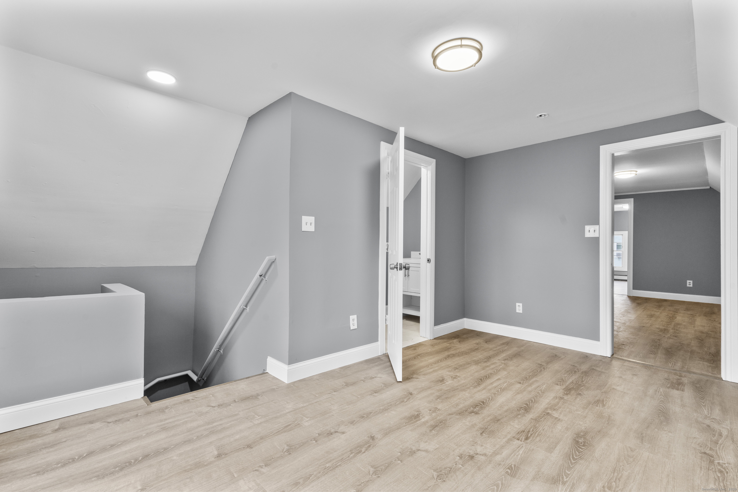 55 Elliott Street, Unit 3 New Haven, CT 06519 - Photo 14 of 18 an empty room with wooden floor and entrance