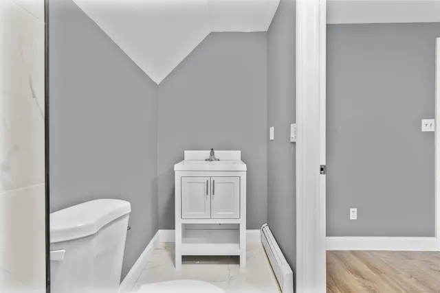 a bathroom with a sink toilet and tub