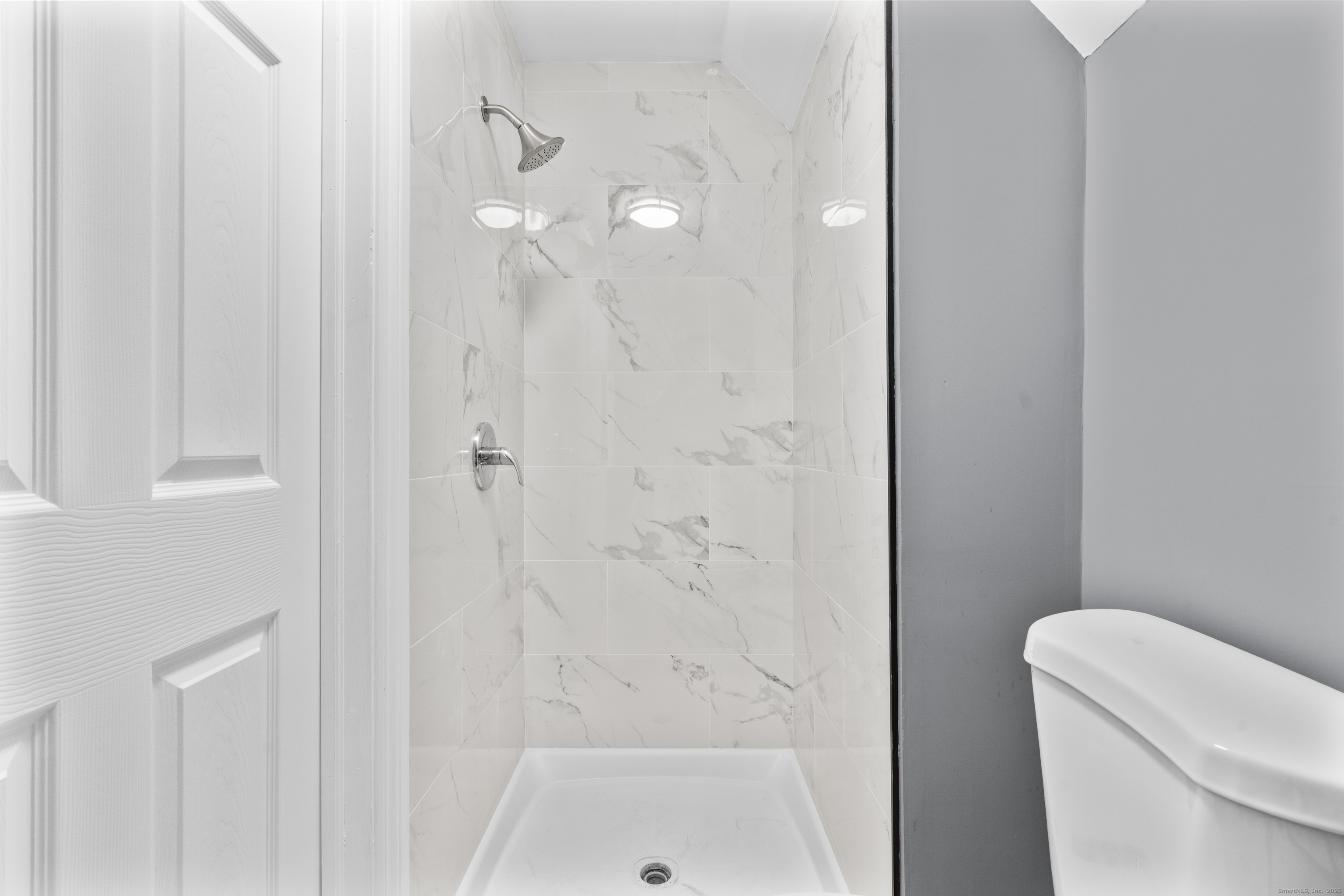 55 Elliott Street, Unit 3 New Haven, CT 06519 - Photo 16 of 18 a bathroom with a shower a toilet and sink