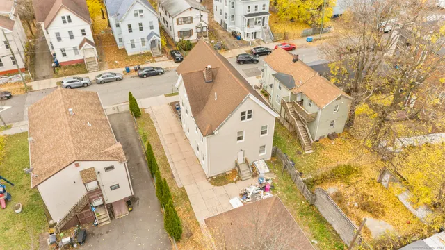 an aerial view of a house with a swimming pool