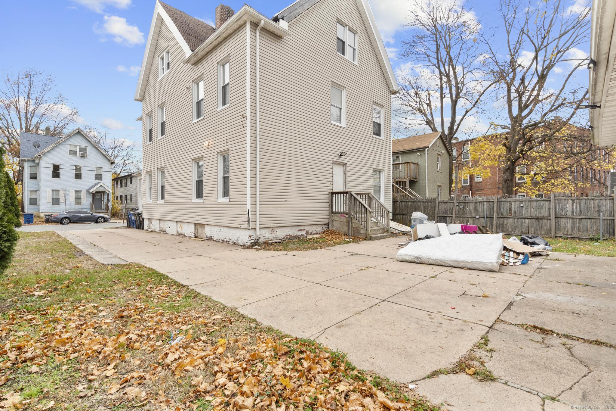 55 Elliott Street, Unit 3 New Haven, CT 06519 - Photo 18 of 18 a view of a white house with snow on the side of the road