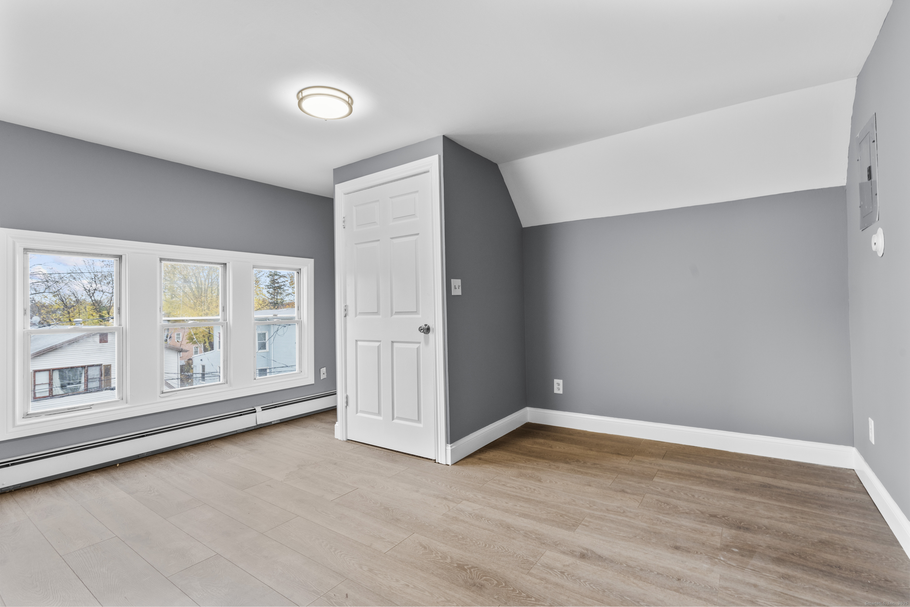 55 Elliott Street, Unit 3 New Haven, CT 06519 - Photo 3 of 18 wooden floor in an empty room with a window