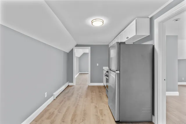 a view of a room with wooden floor and staircase