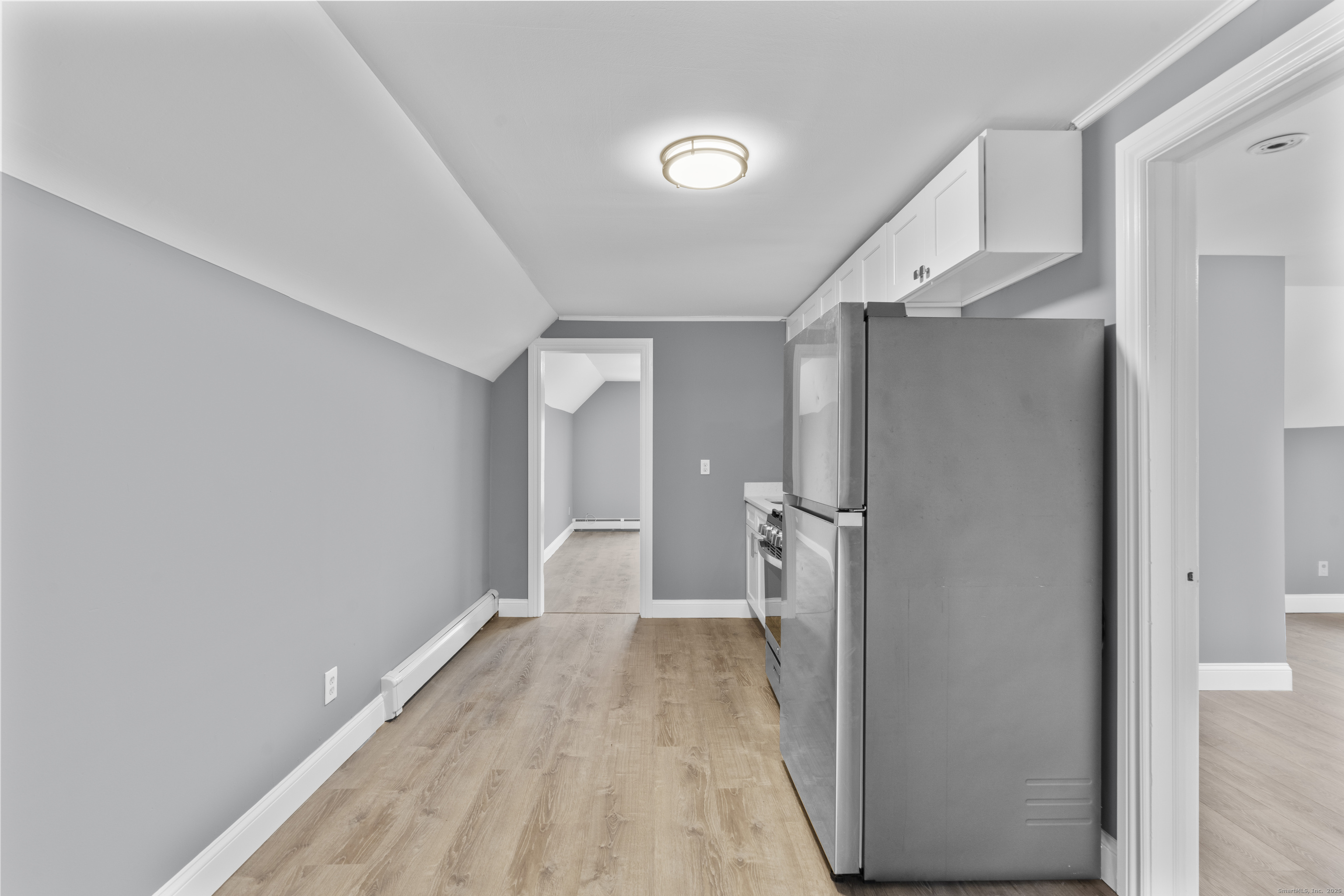 55 Elliott Street, Unit 3 New Haven, CT 06519 - Photo 8 of 18 a view of a room with wooden floor and staircase