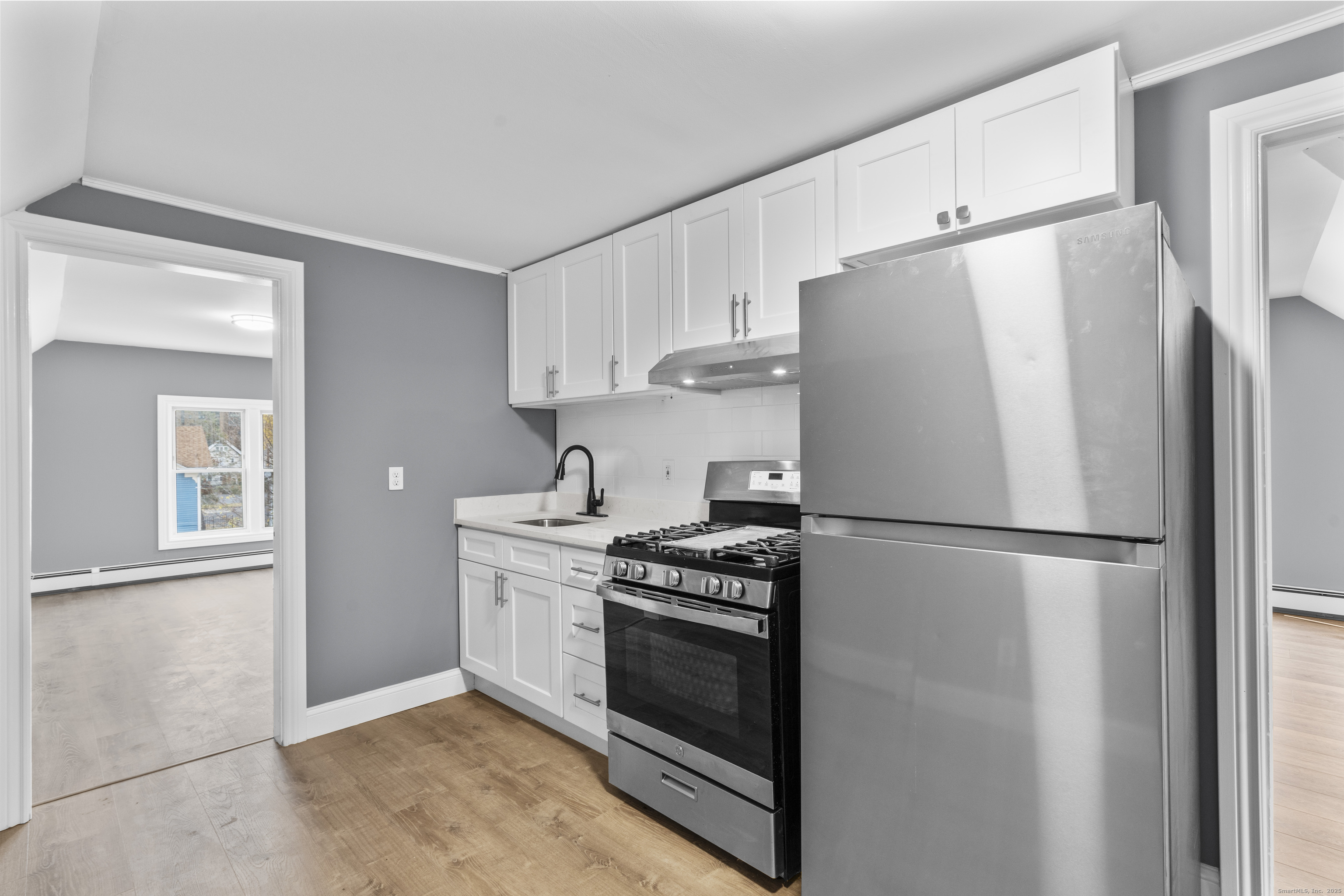 55 Elliott Street, Unit 3 New Haven, CT 06519 - Photo 9 of 18 a white refrigerator freezer and a stove in a kitchen