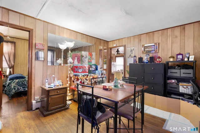 a view of a dining room with furniture and window