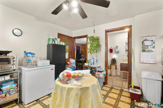 a very nice looking room with a dining table painted walls and white walls