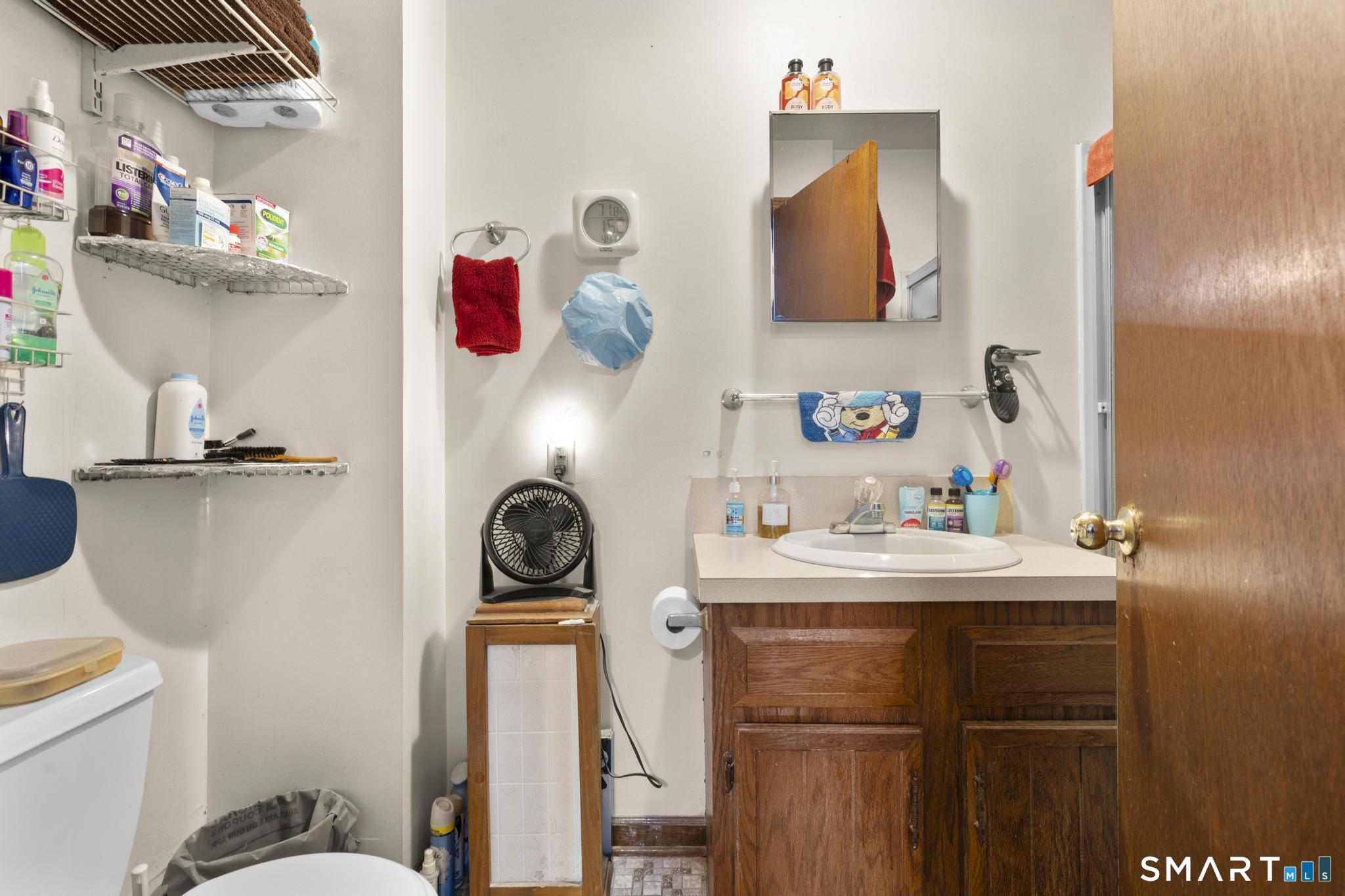 23 North First Street Meriden, CT 06451 - Photo 19 of 29 a bathroom with a sink and a mirror