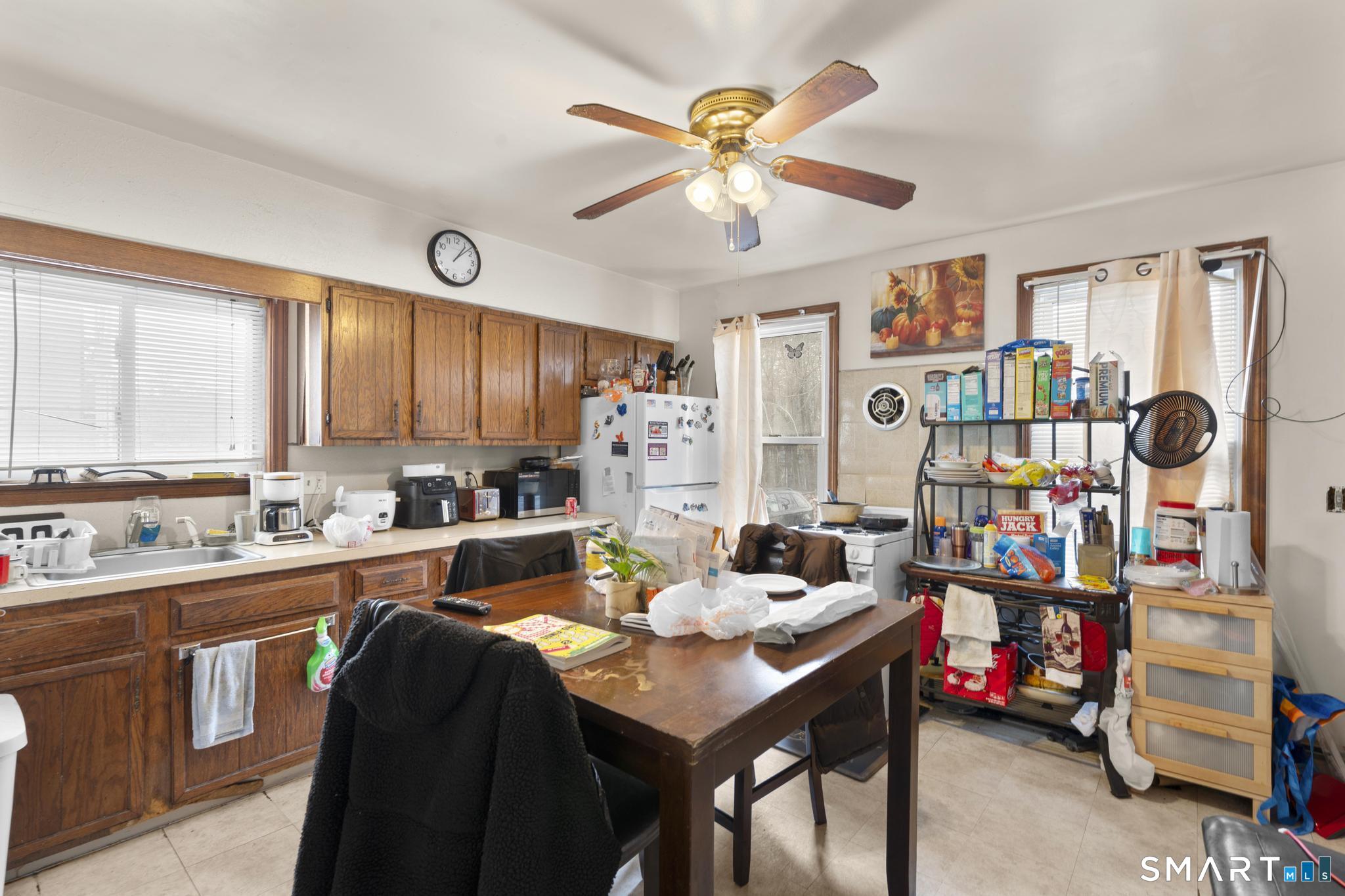 23 North First Street Meriden, CT 06451 - Photo 7 of 29 a view of a dining room with furniture window and wooden floor