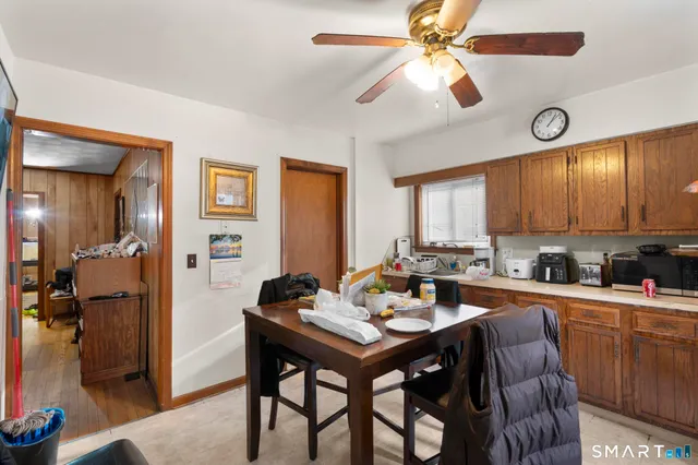 a kitchen with a dining table and chairs