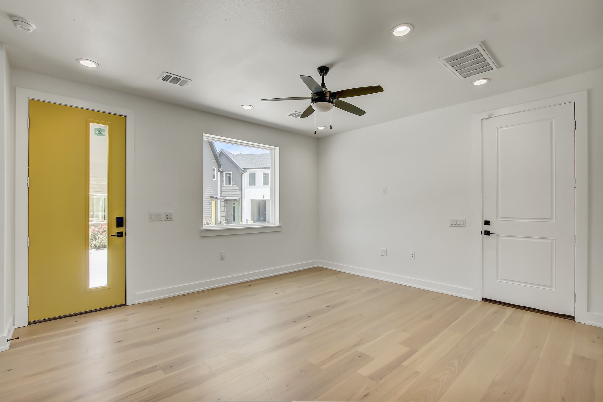 4127 East 12th Street, Unit 8 Austin, TX 78721 - Photo 8 of 32 Foyer entrance with light wood-type flooring, recessed lighting, a ceiling fan, and baseboards