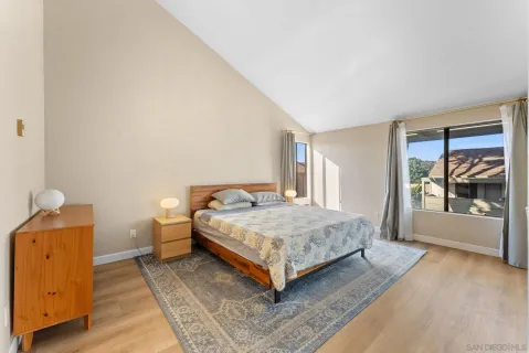 a bedroom with furniture and window