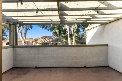 a view of washer and dryer with kitchen in the background
