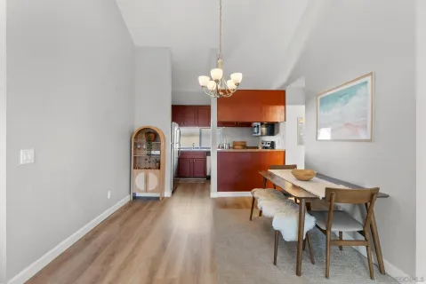 a view of a dining room with furniture and a large window