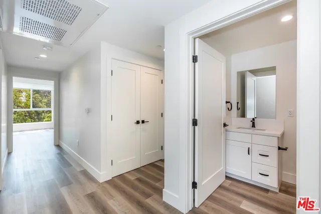 a bathroom with a sink a mirror and a shower