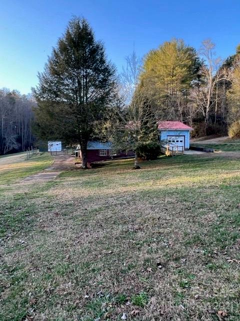 3229 Hiwassee Dam Access Road Murphy, NC 28906 - Photo 3 of 20 a view of a yard with a house in the background