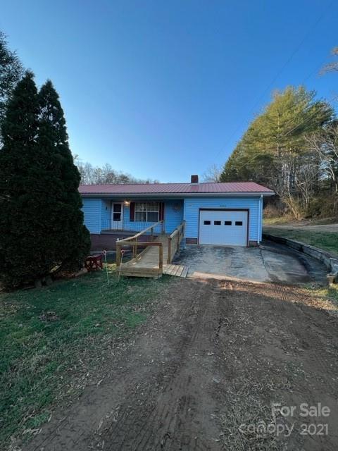 3229 Hiwassee Dam Access Road Murphy, NC 28906 - Photo 7 of 20 a view of a house with backyard and trees