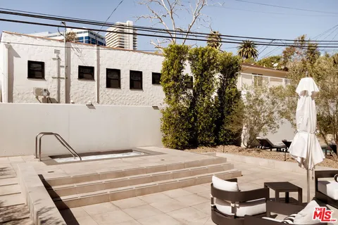 a view of a balcony with a potted plant