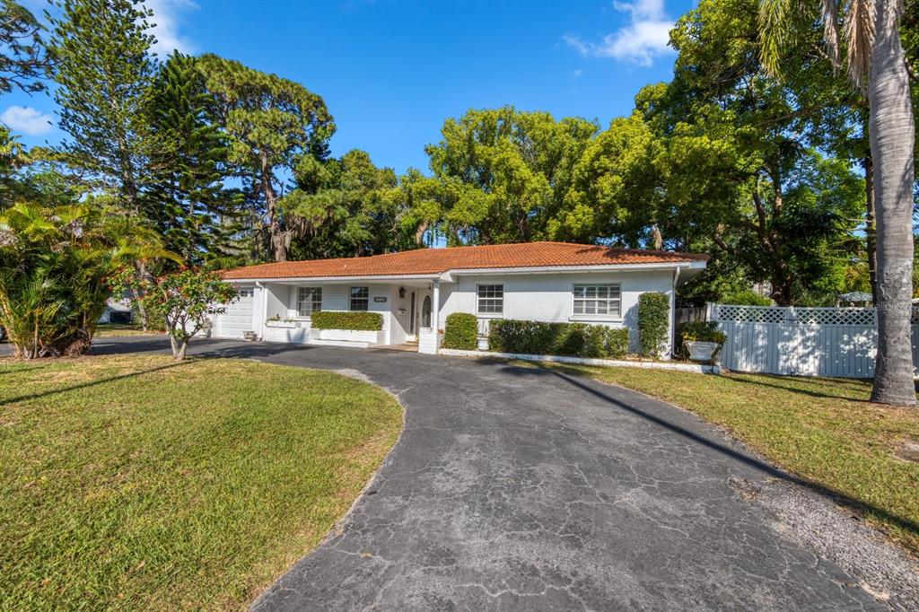 1712 Indian Rocks Road Belleair, FL 33756 - Photo 1 of 1 a front view of a house with a garden