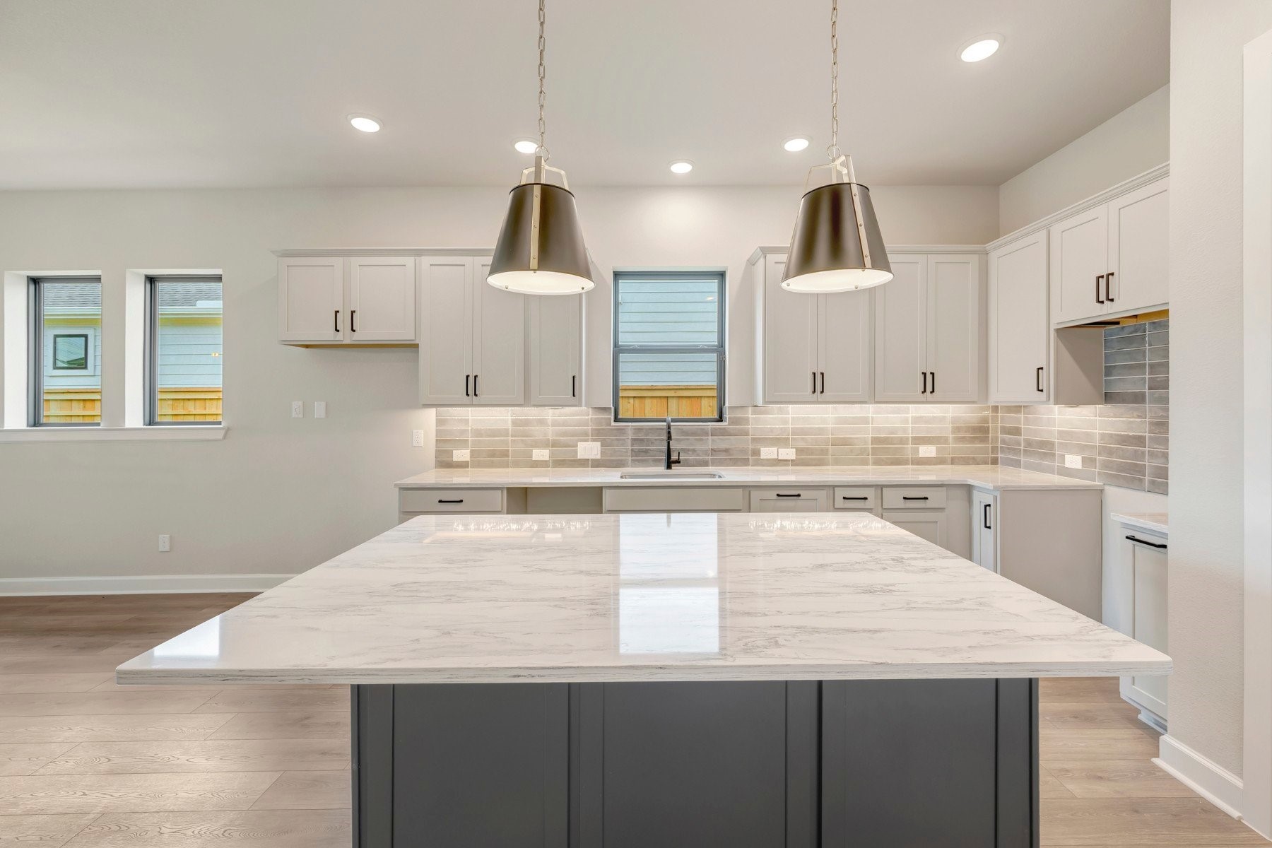 2722 Cottage Place Rosharon, TX 77583 - Photo 21 of 50 a large kitchen with kitchen island a sink stainless steel appliances and cabinets