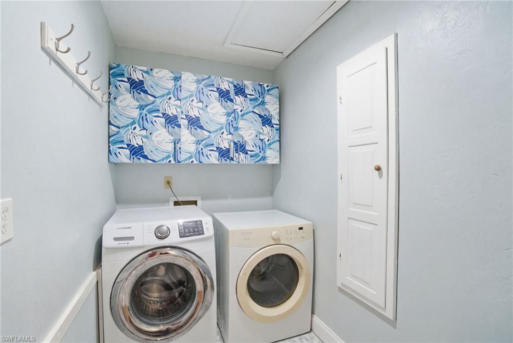 1286 Venetian Way Naples, FL 34110 - Photo 19 of 46 a utility room with dryer and washer