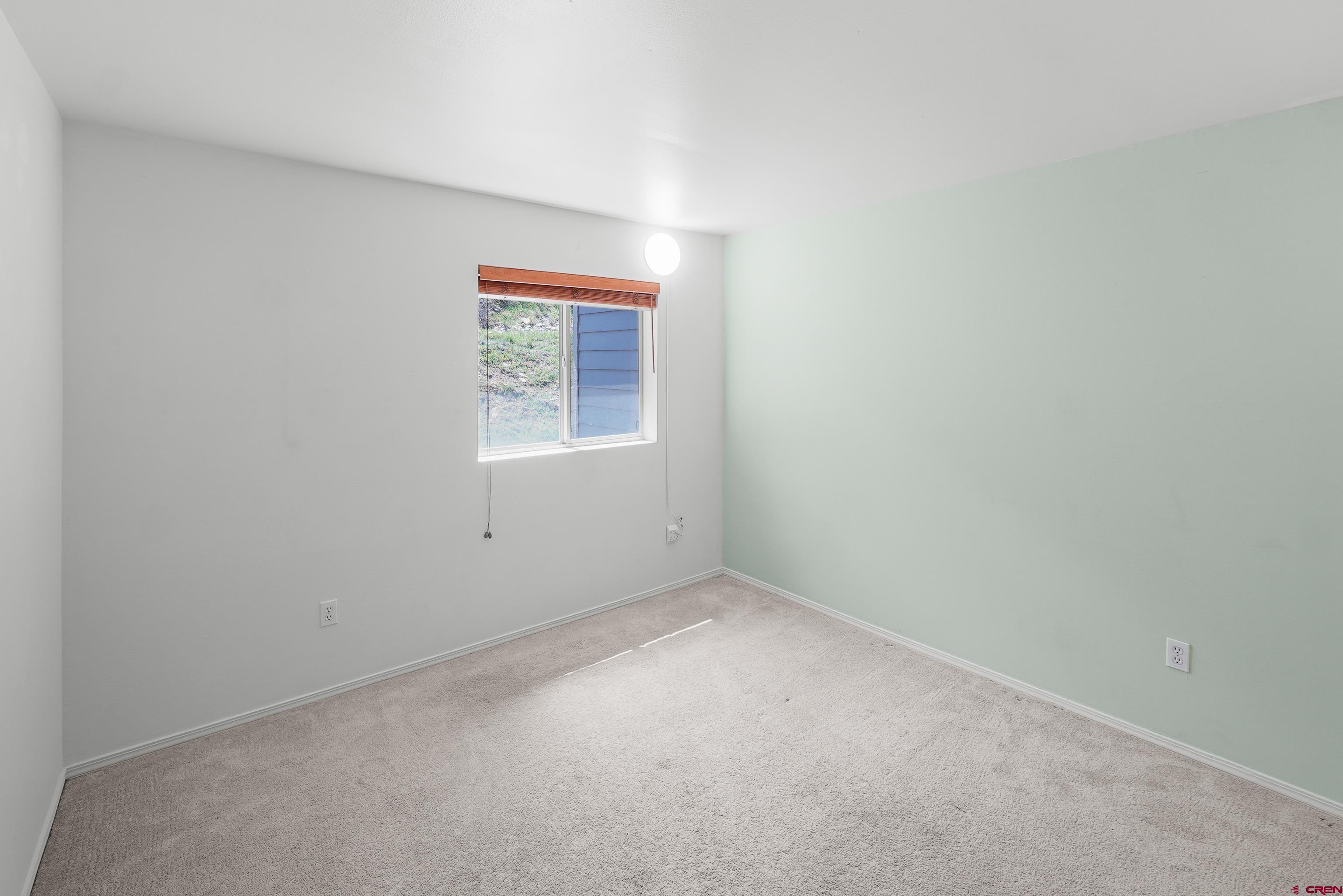 1100 Goeglein Gulch Road, Unit 163 Durango, CO 81301 - Photo 15 of 23 an empty room with a window