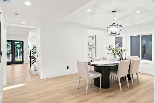 a large kitchen with a table and chairs