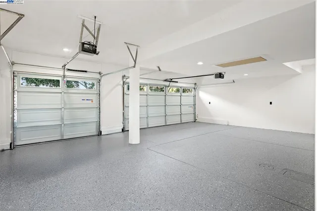 a living room with furniture and flowers