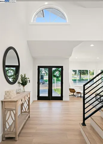 a view of a floor to ceiling window and wooden floor