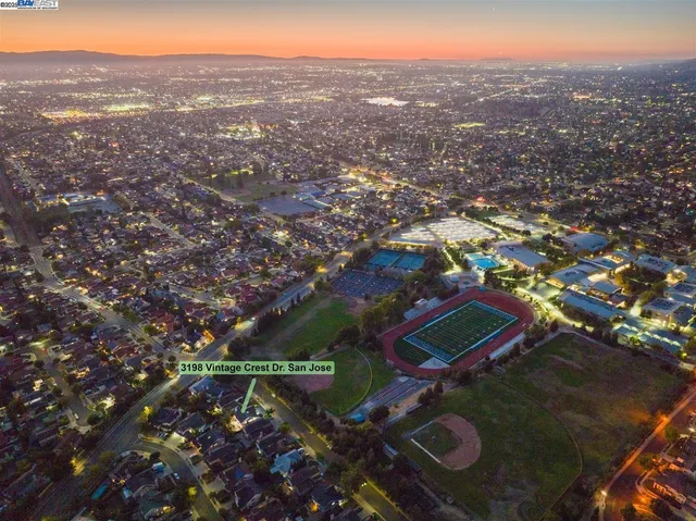 a front view of a house with a yard table and chairs