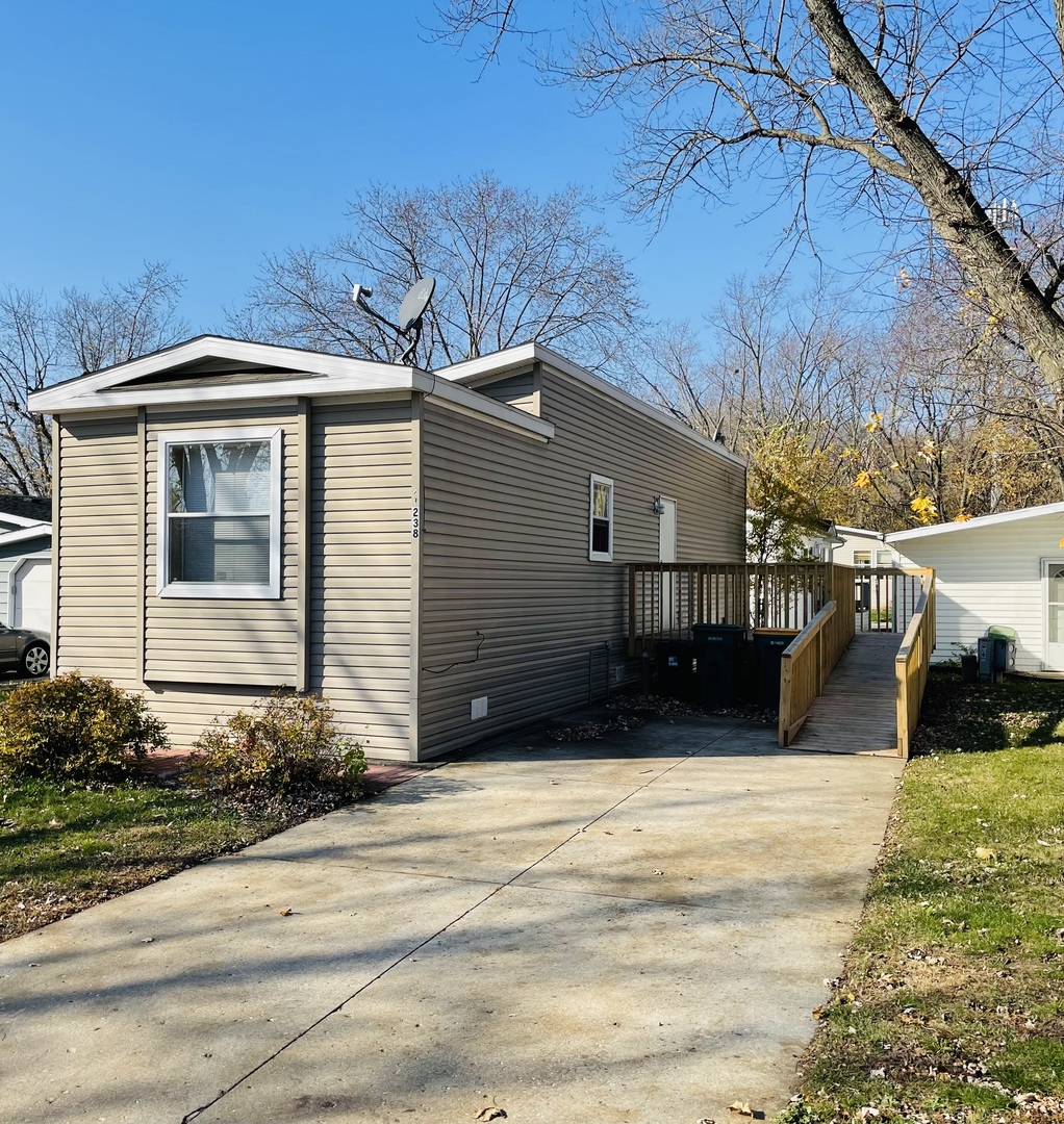 238 Northshore Road Elgin, IL 60123 - Photo 16 of 16 a view of a house with a yard
