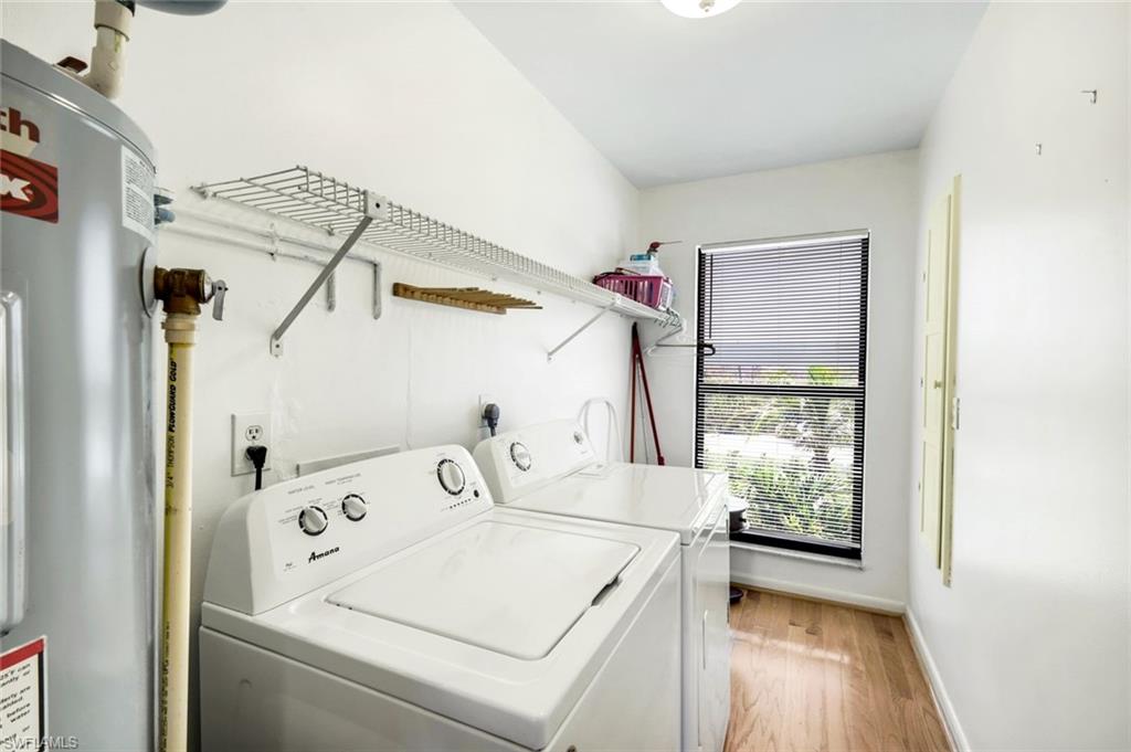647 Rabbit Road Sanibel, FL 33957 - Photo 26 of 46 a utility room with dryer and washer