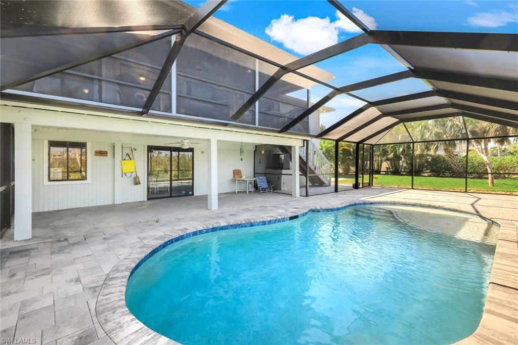 647 Rabbit Road Sanibel, FL 33957 - Photo 7 of 46 a view of a swimming pool with a patio